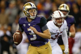 SEATTLE, WA - SEPTEMBER 30:  Quarterback Jake Browning #3 of the Washington Huskies rushes against the Stanford Cardinal on September 30, 2016 at Husky Stadium in Seattle, Washington. The Huskies defeated the Cardinal 44-6.  (Photo by Otto Greule Jr/Getty