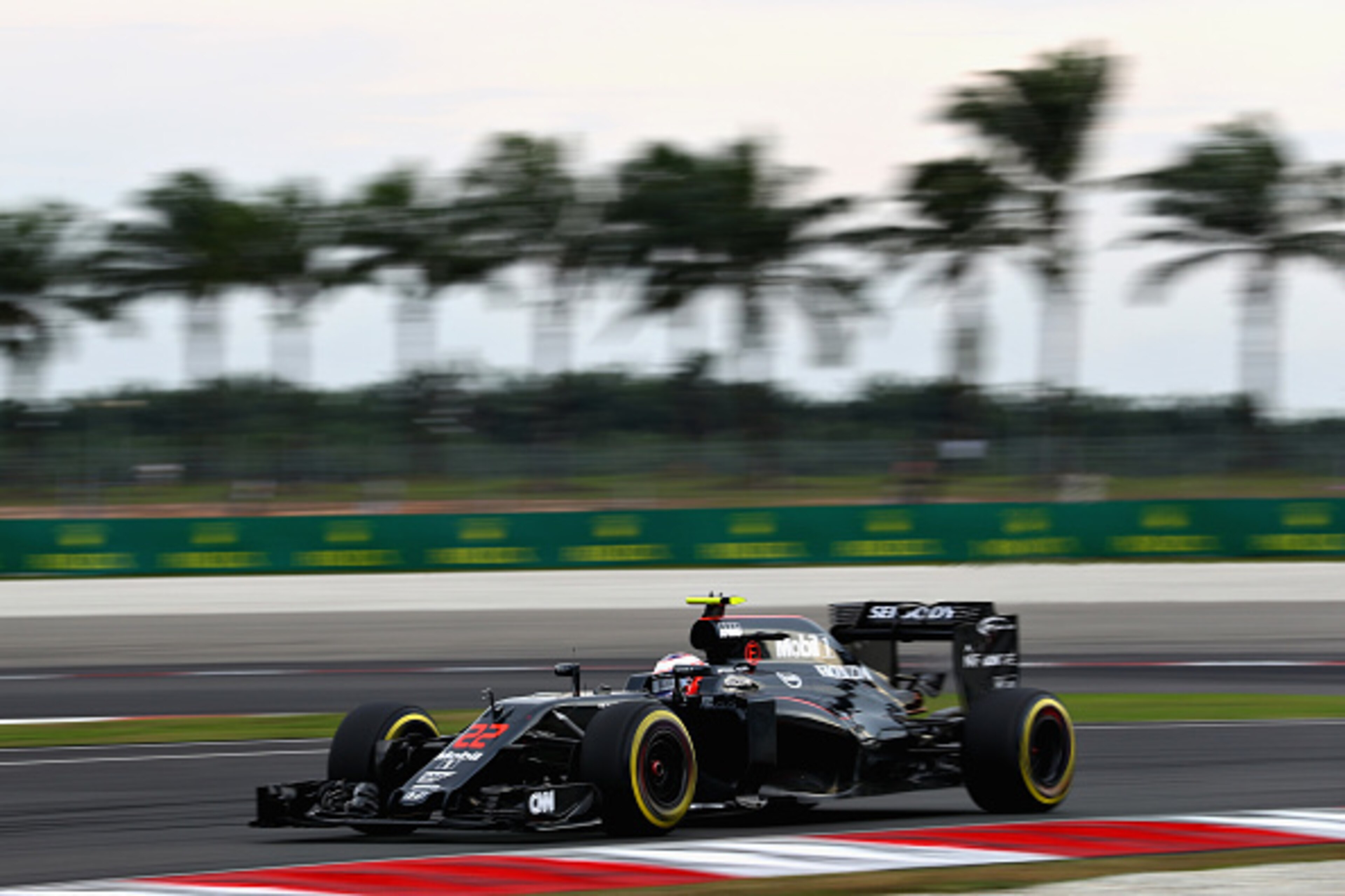 KUALA LUMPUR, MALAYSIA - OCTOBER 01:  Jenson Button of Great Britain driving the (22) McLaren Honda Formula 1 Team McLaren MP4-31 Honda RA616H Hybrid turbo on track during qualifying for the Malaysia Formula One Grand Prix at Sepang Circuit on October 1, 