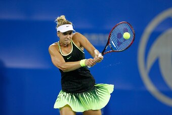 WUHAN, CHINA - SEPTEMBER 25:  Sabine Lisicki of Germany returns a shot against Ekaterina Makarova of Russia in a match against during Day 1 of the 2016 Wuhan Open at Optics Valley International Tennis Center on September 25, 2016 in Wuhan, China.  (Photo 