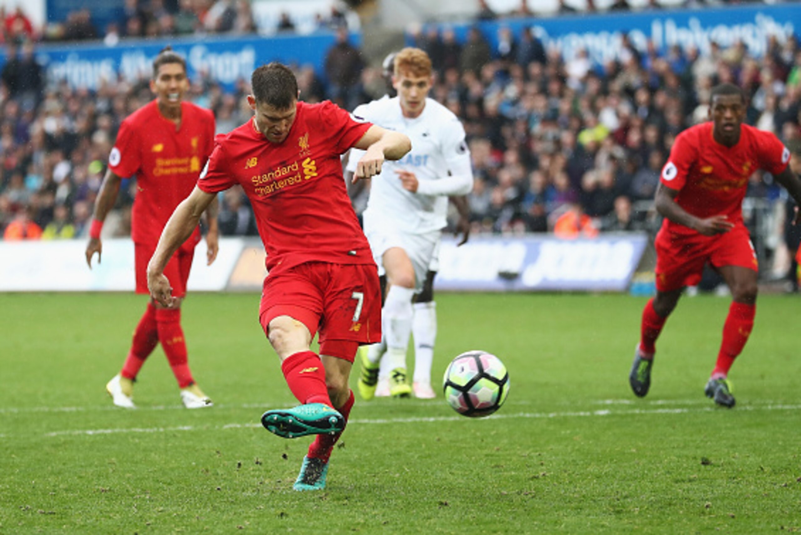 SWANSEA, WALES - OCTOBER 01:  James Milner of Liverpool scores his sides second goal during the Premier League match between Swansea City and Liverpool at Liberty Stadium on October 1, 2016 in Swansea, Wales.  (Photo by Julian Finney/Getty Images)