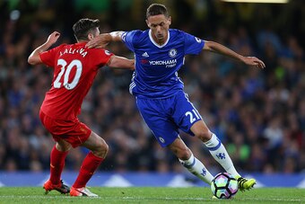 LONDON, ENGLAND - SEPTEMBER 16: Nemanja Matic of Chelsea gets away from Adam Lallana of Liverpool during the Premier League match between Chelsea and Liverpool at Stamford Bridge on September 16, 2016 in London, England. (Photo by Catherine Ivill - AMA/Ge