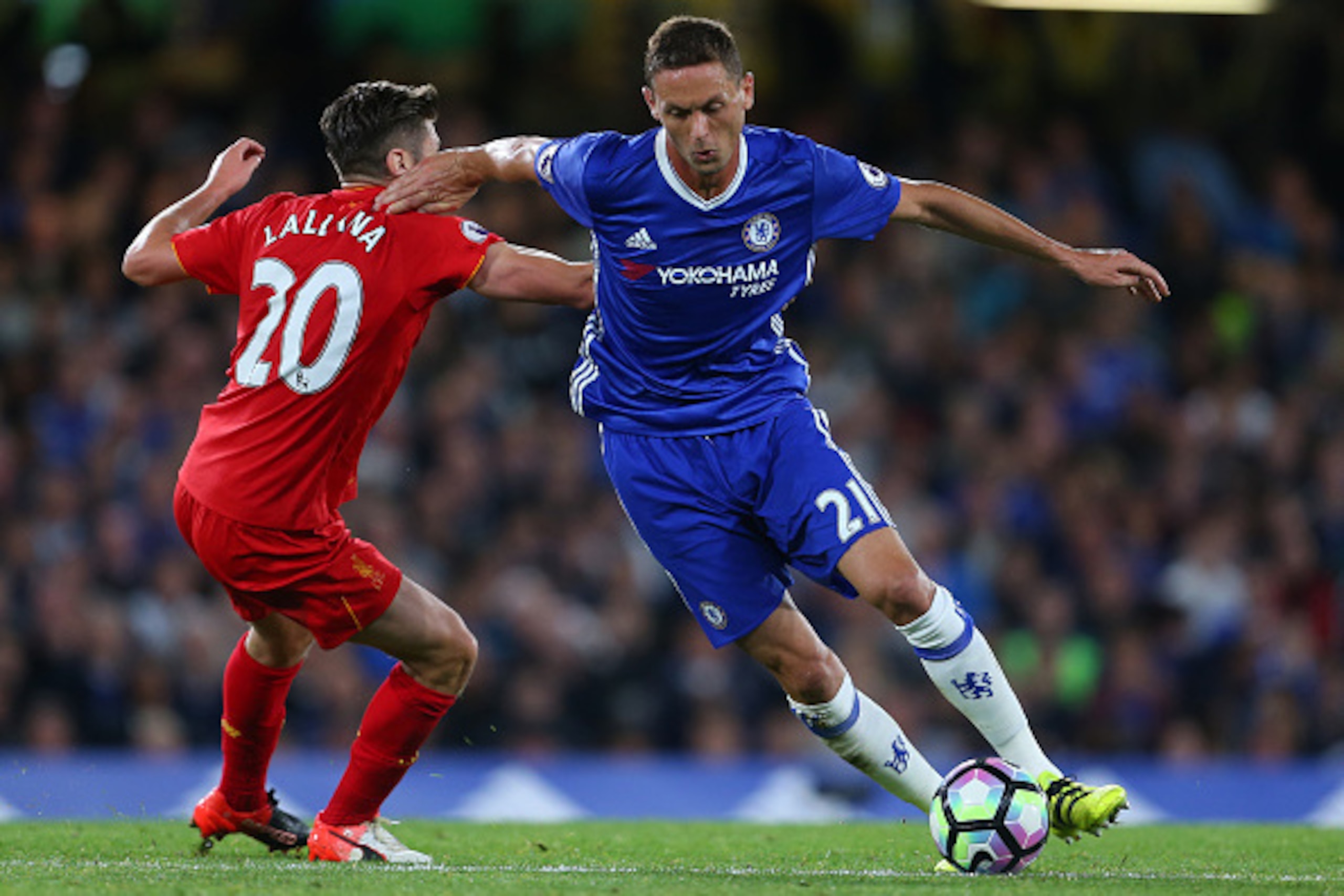 LONDON, ENGLAND - SEPTEMBER 16: Nemanja Matic of Chelsea gets away from Adam Lallana of Liverpool during the Premier League match between Chelsea and Liverpool at Stamford Bridge on September 16, 2016 in London, England. (Photo by Catherine Ivill - AMA/Ge