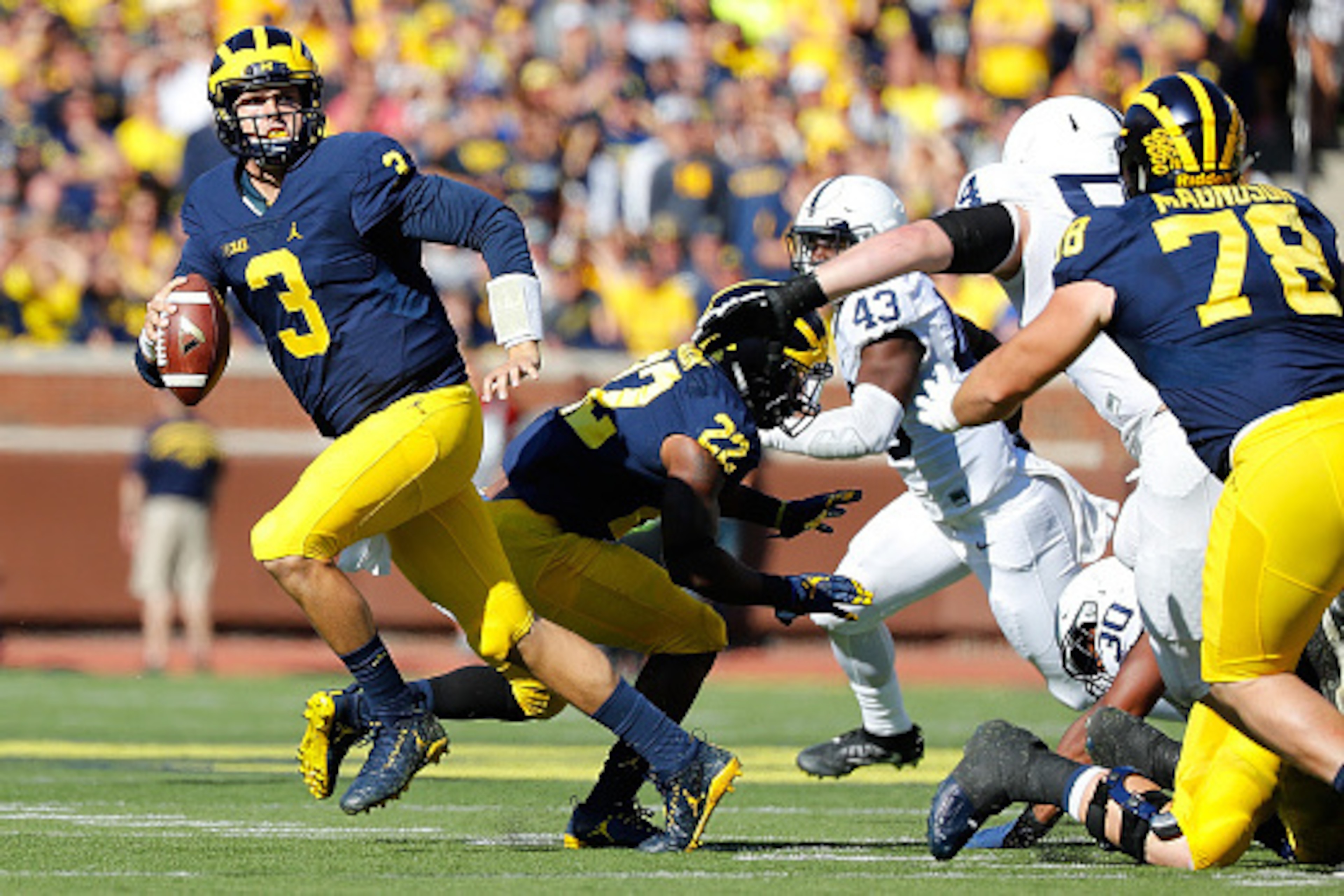 ANN ARBOR, MI - SEPTEMBER 24: Wilton Speight #3 of the Michigan Wolverines rolls out to pass during the third quarter of the game against the Penn State Nittany Lions at Michigan Stadium on September 24, 2016 in Ann Arbor, Michigan. Michigan defeated the 