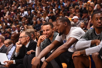 VANCOUVER, BC - OCTOBER 1:  Stephen Curry #30 of the Golden State Warriors and Kevin Durant #35 of the Golden State Warriors talk on the bench during the game against the Toronto Raptors during a preseason game on October 1, 2016 at Rogers Arena in Vancou