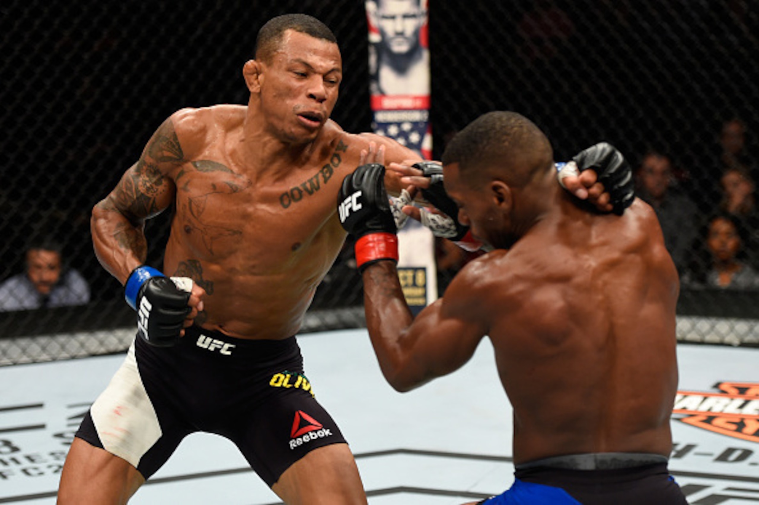 PORTLAND, OR - OCTOBER 01:  (L-R) Alex Oliveira of Brazil punches Will Brooks in their lightweight bout during the UFC Fight Night event at the Moda Center on October 1, 2016 in Portland, Oregon. (Photo by Josh Hedges/Zuffa LLC/Zuffa LLC via Getty Images)