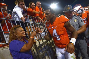 CLEMSON, SC - OCTOBER 01: Deshaun Watson #4 of the Clemson Tigers is congratulated by fans after his teams vicotry over the Louisville Cardinals at Memorial Stadium on October 1, 2016 in Clemson, South Carolina. The Clemson Tigers defeated the Louisville 