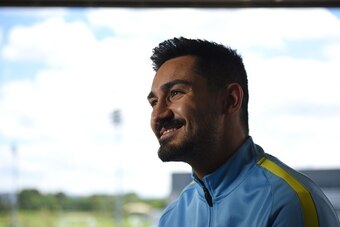 Manchester City's German midfielder Ilkay Gundogan speaks to members of the media at the City Football Academy in Manchester, north west England on July 3, 2016.
llkay Gundogan is the first signing of the Pep Guardiola era. The 25-year-old German midfield