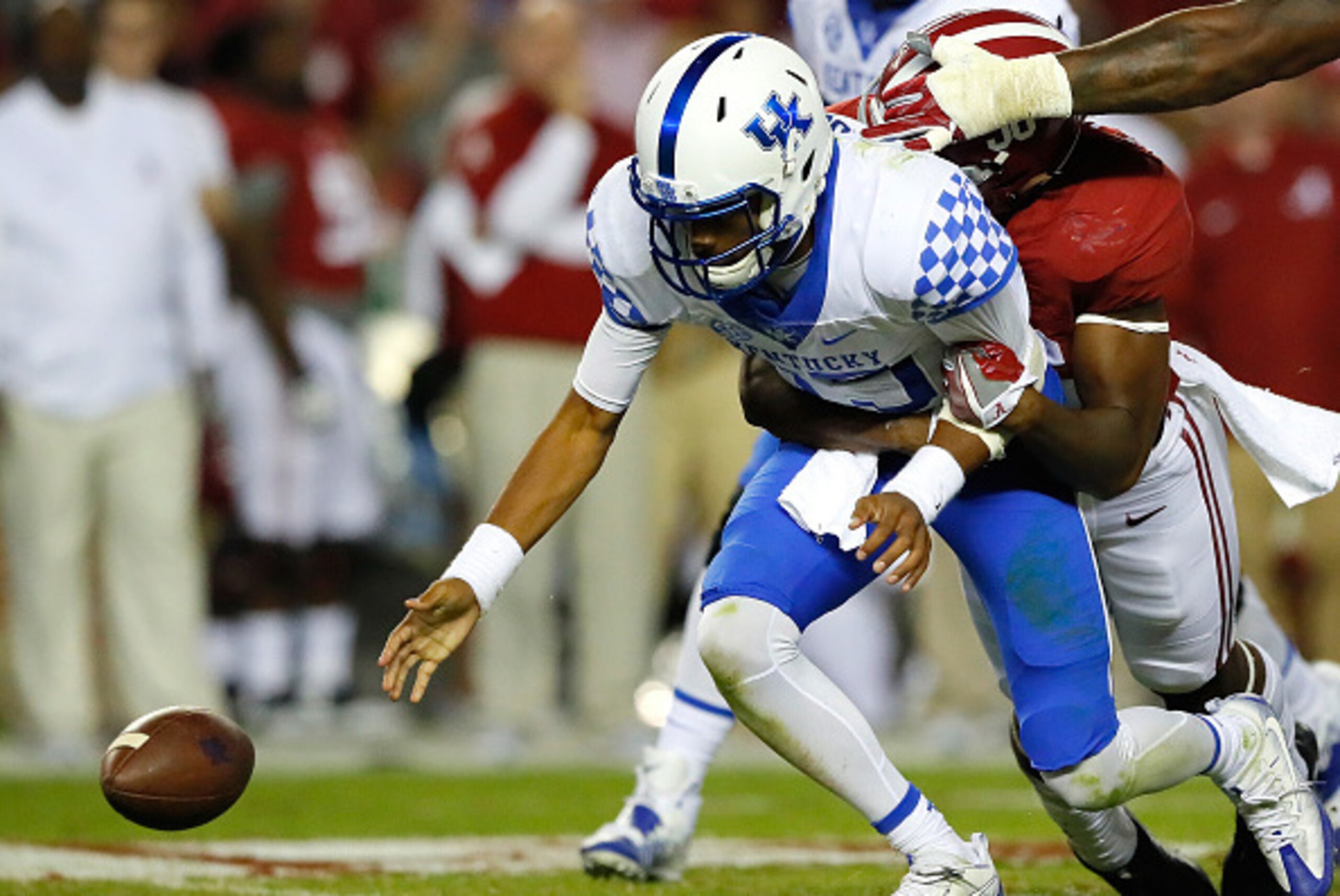 TUSCALOOSA, AL - OCTOBER 01:  Tim Williams #56 of the Alabama Crimson Tide strips the ball and forces a fumble by Stephen Johnson #15 of the Kentucky Wildcats at Bryant-Denny Stadium on October 1, 2016 in Tuscaloosa, Alabama.  (Photo by Kevin C. Cox/Getty