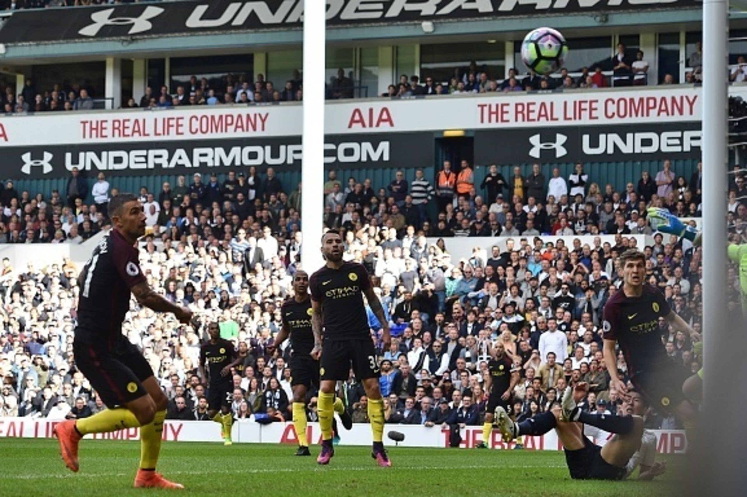 Manchester City's Serbian defender Aleksandar Kolarov (L) watches his attempted clearance bounce into the net for an own goal during the English Premier League football match between Tottenham Hotspur and Manchester City at White Hart Lane in London, on O