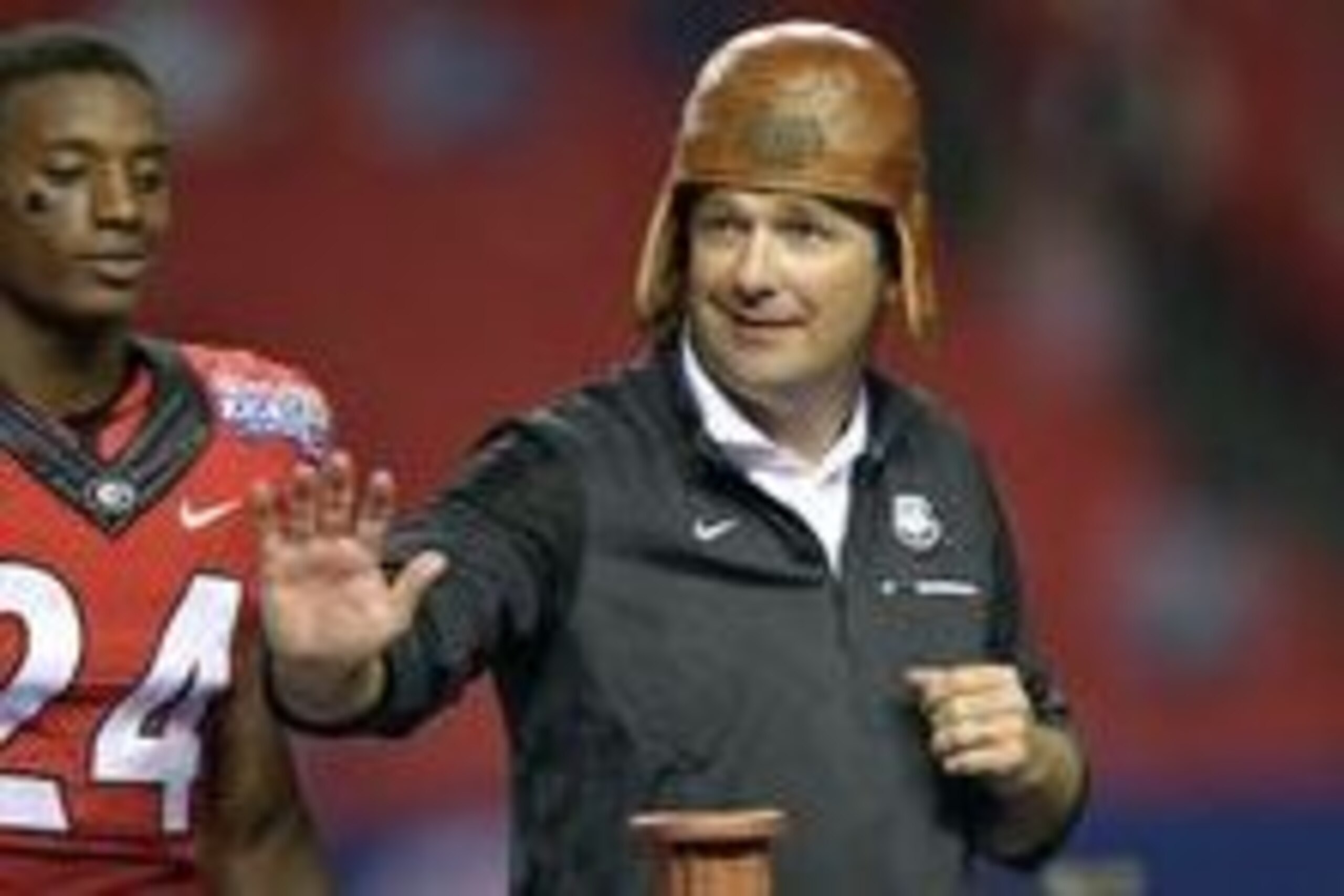 Sep 3, 2016; Atlanta, GA, USA; Georgia Bulldogs head coach Kirby Smart puts on the Old Leather Helmet after the 2016 Chick-Fil-A Kickoff game against the North Carolina Tar Heels at Georgia Dome. Georgia won 33-24. Mandatory Credit: Dale Zanine-USA TODAY Sep 3, 2016; Atlanta, GA, USA; Georgia Bulldogs head coach Kirby Smart puts on the Old Leather Helmet after the 2016 Chick-Fil-A Kickoff game against the North Carolina Tar Heels at Georgia Dome. Georgia won 33-24. Mandatory Credit: Dale Zanine-USA TODAY