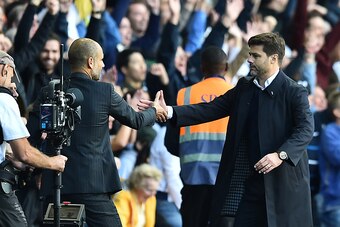 Tottenham Hotspur's Argentinian head coach Mauricio Pochettino (R) shakes hands with Manchester City's Spanish manager Pep Guardiola after the English Premier League football match between Tottenham Hotspur and Manchester City at White Hart Lane in London