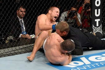 BARUERI, BRAZIL - OCTOBER 9:  (L-R) Mike Pierce screams while getting submitted by Rousimar Palhares in their welterweight bout during the UFC Fight Night event at the Ginasio Jose Correa on October 9, 2013 in Barueri, Sao Paulo, Brazil. (Photo by Jeff Bo