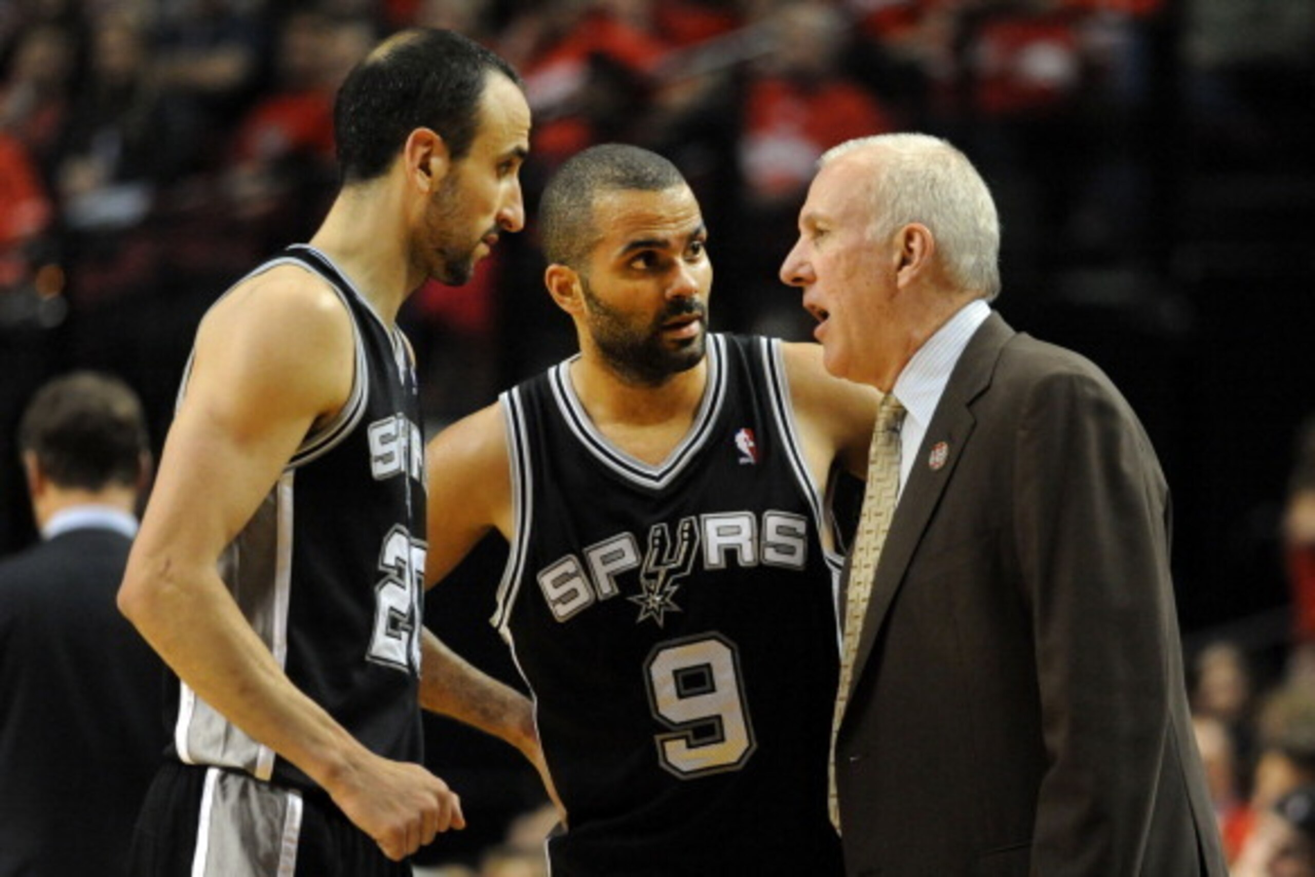 PORTLAND, OR - MAY 10: Gregg Popovich of the San Antonio Spurs speaks with Manu Ginobili #20 and Tony Parker #9 of the San Antonio Spurs in the second half of Game Three of the Western Conference Semifinals against the Portland Trail Blazers during the 20