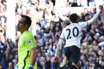 Tottenham Hotspur's English midfielder Dele Alli celebrates after scoring their second goal as Manchester City's Chilean goalkeeper Claudio Bravo (L) reacts during the English Premier League football match between Tottenham Hotspur and Manchester City at 