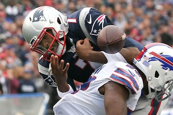 FOXBORO, MA - OCTOBER 02:  Jacoby Brissett #7 of the New England Patriots fumbles the ball as he is hit by Zach Brown #53 Buffalo Bills in the first half at Gillette Stadium on October 2, 2016 in Foxboro, Massachusetts.  (Photo by Jim Rogash/Getty Images)