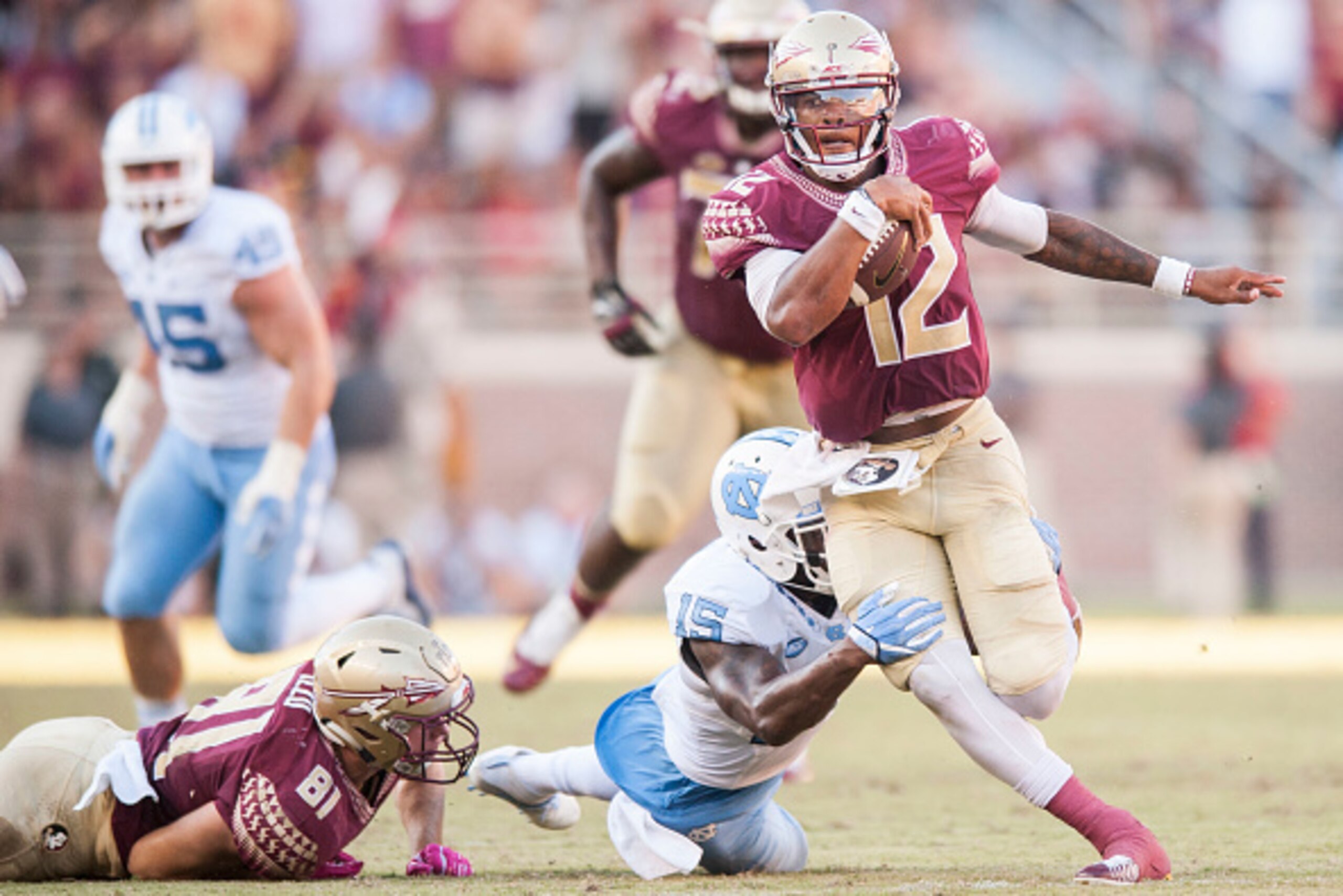 TALLAHASSEE, FL - OCTOBER 01: Donnie Miles #15 of the North Carolina Tar Heels attempts to tackle Deondre Francois #12 of the Florida State Seminoles at Doak Campbell Stadium on October 1, 2016 in Tallahassee, Florida. (Photo by Jeff Gammons/Getty Images)