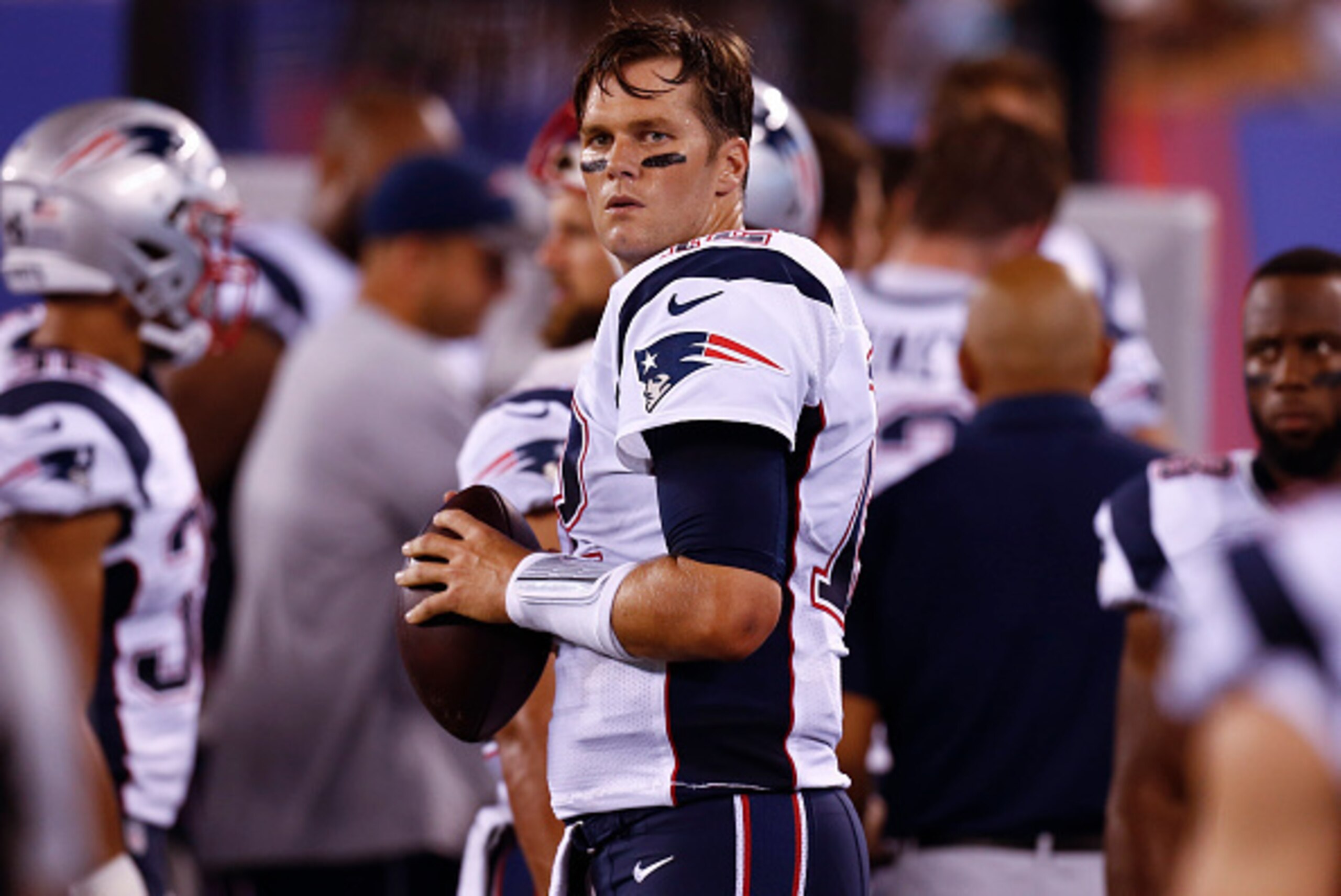 EAST RUTHERFORD, NJ - SEPTEMBER 01: Tom Brady #12 of the New England Patriots warms up on the sidelines during their preseason game against the New York Giants at MetLife Stadium on September 1, 2016 in East Rutherford, New Jersey. (Photo by Jeff Zelevans