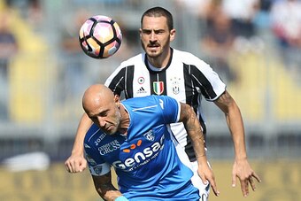 EMPOLI, ITALY - OCTOBER 02: Massimo Maccarone of Empoli FC battles for the ball with Leonardo Bonucci of Juventus FC during the Serie A match between Empoli FC and Juventus FC at Stadio Carlo Castellani on October 2, 2016 in Empoli, Italy.  (Photo by Gabr