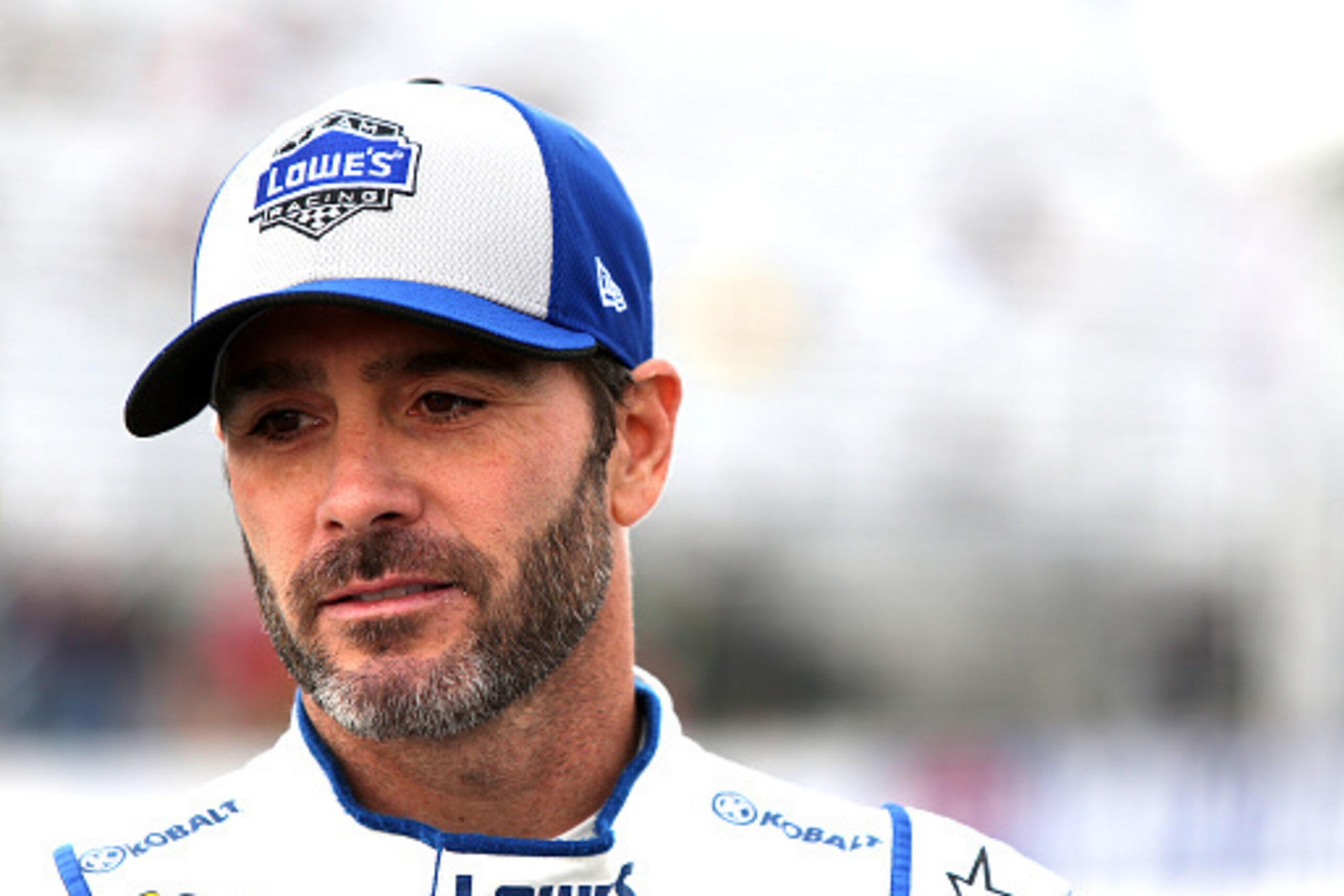 LOUDON, NH - SEPTEMBER 23:  Jimmie Johnson, driver of the #48 Lowe's Chevrolet, stands on the grid during qualifying for the NASCAR Sprint Cup Series Bad Boy Off Road 300 at New Hampshire Motor Speedway on September 23, 2016 in Loudon, New Hampshire.  (Ph