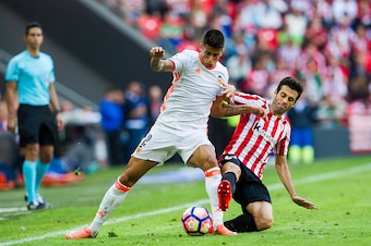 BILBAO, SPAIN - SEPTEMBER 18:  Joao Cancelo of Valencia CF competes for the ball with Markel Susaeta of Athletic Club  during the La Liga match between Athletic Club Bilbao and Valencia CF at San Mames Stadium on September 18, 2016 in Bilbao, Spain.  (Pho