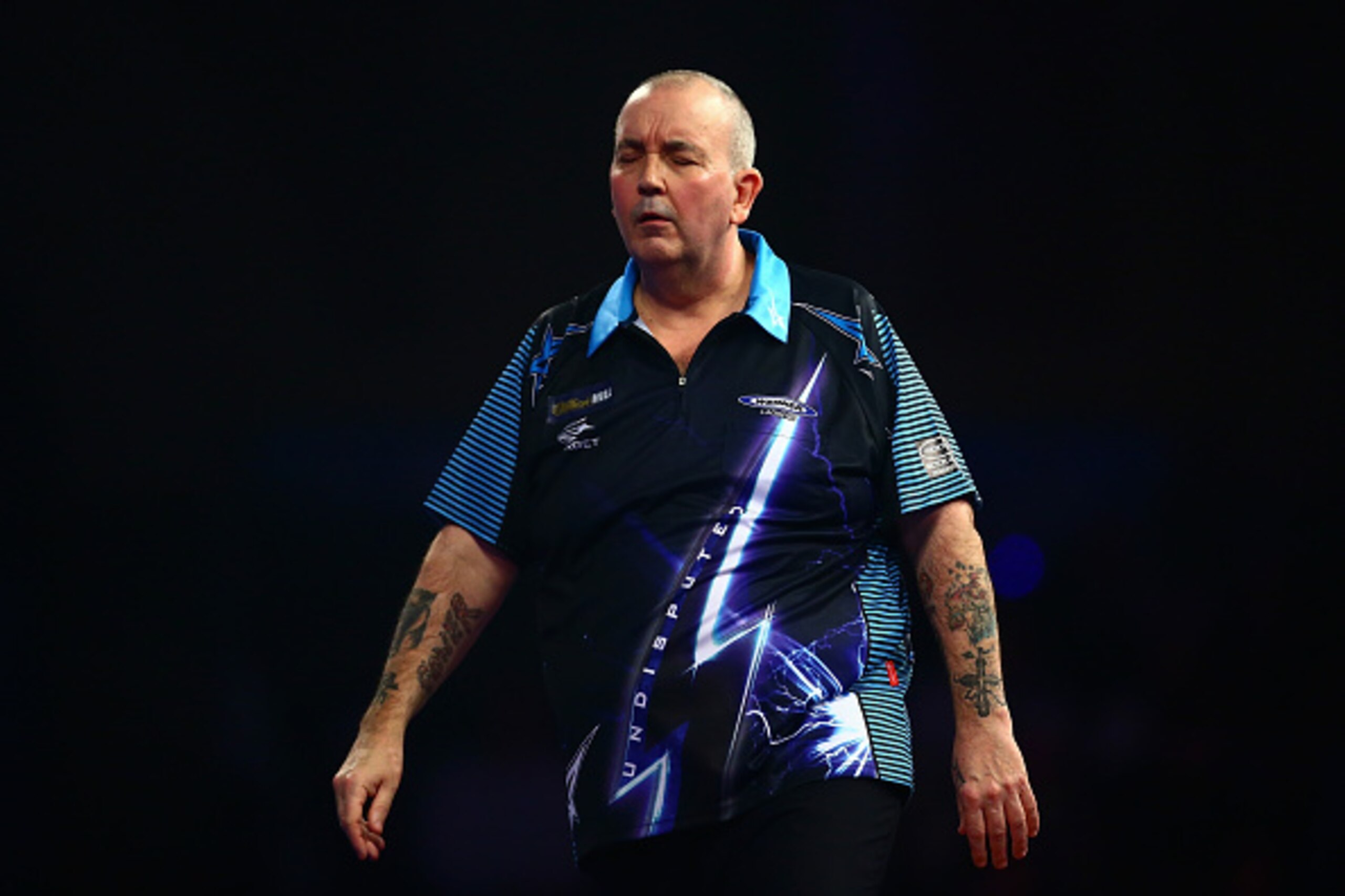 LONDON, ENGLAND - DECEMBER 30:  Phil Taylor of England looks dejected in his third round match against Jelle Klaasen of the Netherlands on Day Twelve of the 2016 William Hill PDC World Darts Championships at Alexandra Palace on December 30, 2015 in London
