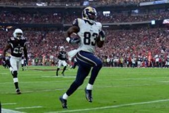 Oct 2, 2016; Glendale, AZ, USA; Los Angeles Rams wide receiver Brian Quick (83) carries the ball to score a touchdown after making a reception against the Arizona Cardinals during the first half at University of Phoenix Stadium. Mandatory Credit: Joe Camp