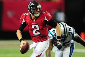 ATLANTA, GA - OCTOBER 2: Matt Ryan #2 of the Atlanta Falcons scrambles away from Charles Johnson #95 of the Carolina Panthers at the Georgia Dome on October 2, 2016 in Atlanta, Georgia. (Photo by Scott Cunningham/Getty Images)