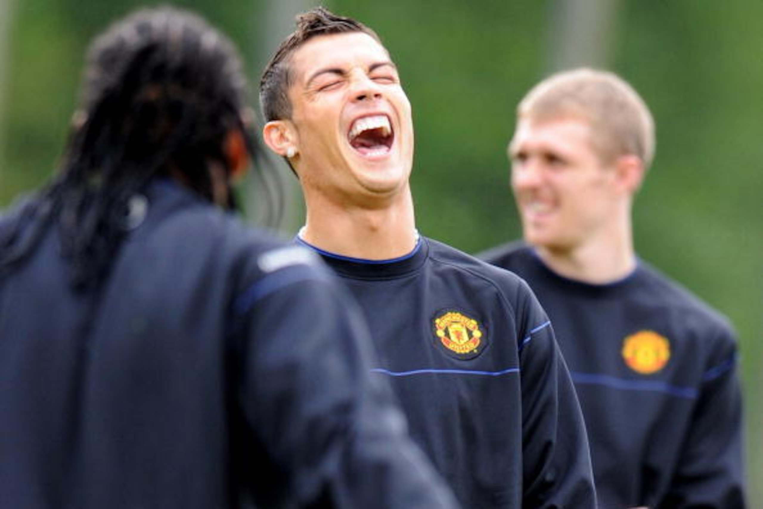 Manchester United's Portugese midfielder Cristiano Ronaldo (C) laughs during a training session at their Carrington training ground in Manchester, north-west England, on April 28, 2009. Manchester United take on Arsenal in the first leg of their UEFA Cham Manchester United's Portugese midfielder Cristiano Ronaldo (C) laughs during a training session at their Carrington training ground in Manchester, north-west England, on April 28, 2009. Manchester United take on Arsenal in the first leg of their UEFA Cham