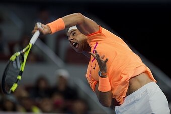 Rafael Nadal of Spain serves against Paolo Lorenzi of Italy during the first round of the China Open tennis tournament in Beijing on October 4, 2016. / AFP / NICOLAS ASFOURI        (Photo credit should read NICOLAS ASFOURI/AFP/Getty Images)
