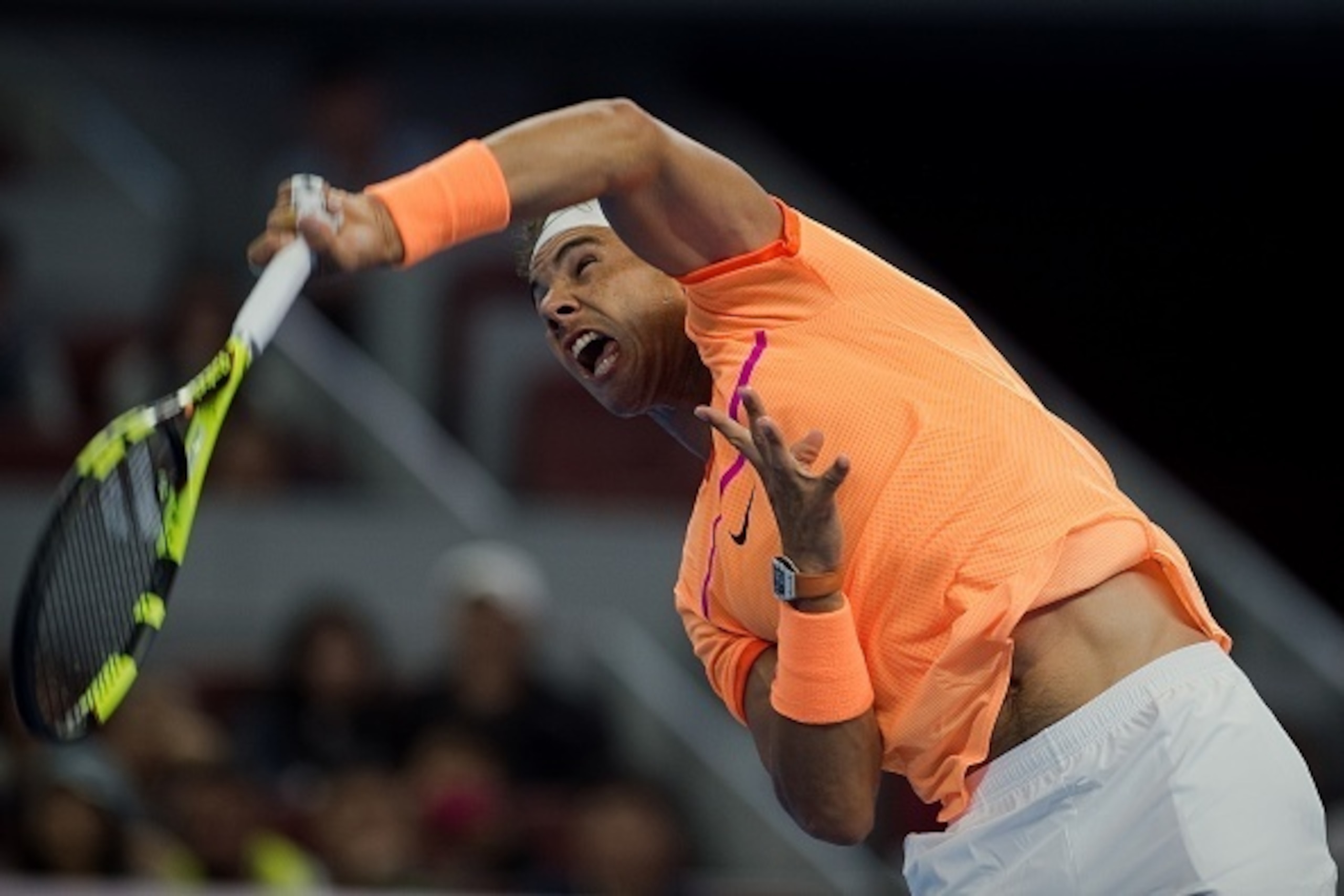 Rafael Nadal of Spain serves against Paolo Lorenzi of Italy during the first round of the China Open tennis tournament in Beijing on October 4, 2016. / AFP / NICOLAS ASFOURI        (Photo credit should read NICOLAS ASFOURI/AFP/Getty Images)