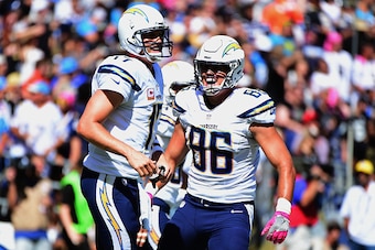 SAN DIEGO, CA - OCTOBER 02:  Philip Rivers #17 and  Hunter Henry #86 of the San Diego Chargers celebrate in the end zone after a touchdown in the first half against the New Orleans Saints  at Qualcomm Stadium on October 2, 2016 in San Diego, California.  