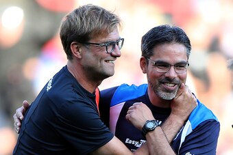 HUDDERSFIELD, ENGLAND - JULY 20:  David Wagner (R) manager of Huddersfield Town greets Juergen Klopp manager of Liverpool prior the Pre-Season Friendly match between Huddersfield Town and Liverpool at the Galpharm Stadium on July 20, 2016 in Huddersfield,