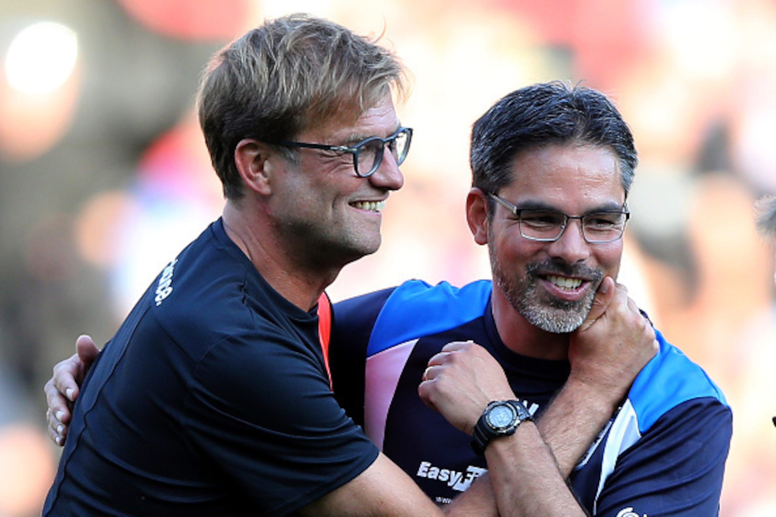 HUDDERSFIELD, ENGLAND - JULY 20:  David Wagner (R) manager of Huddersfield Town greets Juergen Klopp manager of Liverpool prior the Pre-Season Friendly match between Huddersfield Town and Liverpool at the Galpharm Stadium on July 20, 2016 in Huddersfield,