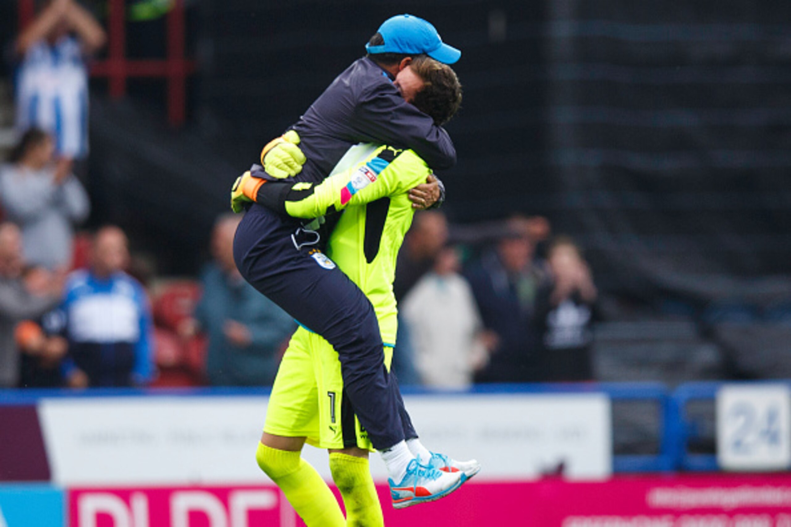 HUDDERSFIELD, ENGLAND - AUGUST 27: David Wagner head coach / manager  of Huddersfield Town celebrates with Goalkeeper Danny Ward of Huddersfield Town at full time during the Sky Bet Championship match between Huddersfield Town and Wolverhampton Wanderers 