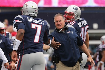 FOXBORO, MA - SEPTEMBER 18:  Head coach Bill Belichick of the New England Patriots high fives Jacoby Brissett #7 during the second half against the Miami Dolphins at Gillette Stadium on September 18, 2016 in Foxboro, Massachusetts.  (Photo by Jim Rogash/G