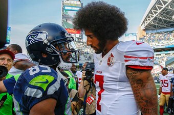SEATTLE, WA - SEPTEMBER 25:  Quarterback Colin Kaepernick #7 of the San Francisco 49ers talks with wide receiver Doug Baldwin #89 of the Seattle Seahawks after the game at CenturyLink Field on September 25, 2016 in Seattle, Washington.  (Photo by Otto Gre