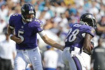 Sep 25, 2016; Jacksonville, FL, USA;  Baltimore Ravens quarterback Joe Flacco (5) hands the ball off to Baltimore Ravens running back Terrance West (28) in the second half against the Jacksonville Jaguars at EverBank Field. Baltimore Ravens won 19-17. Man
