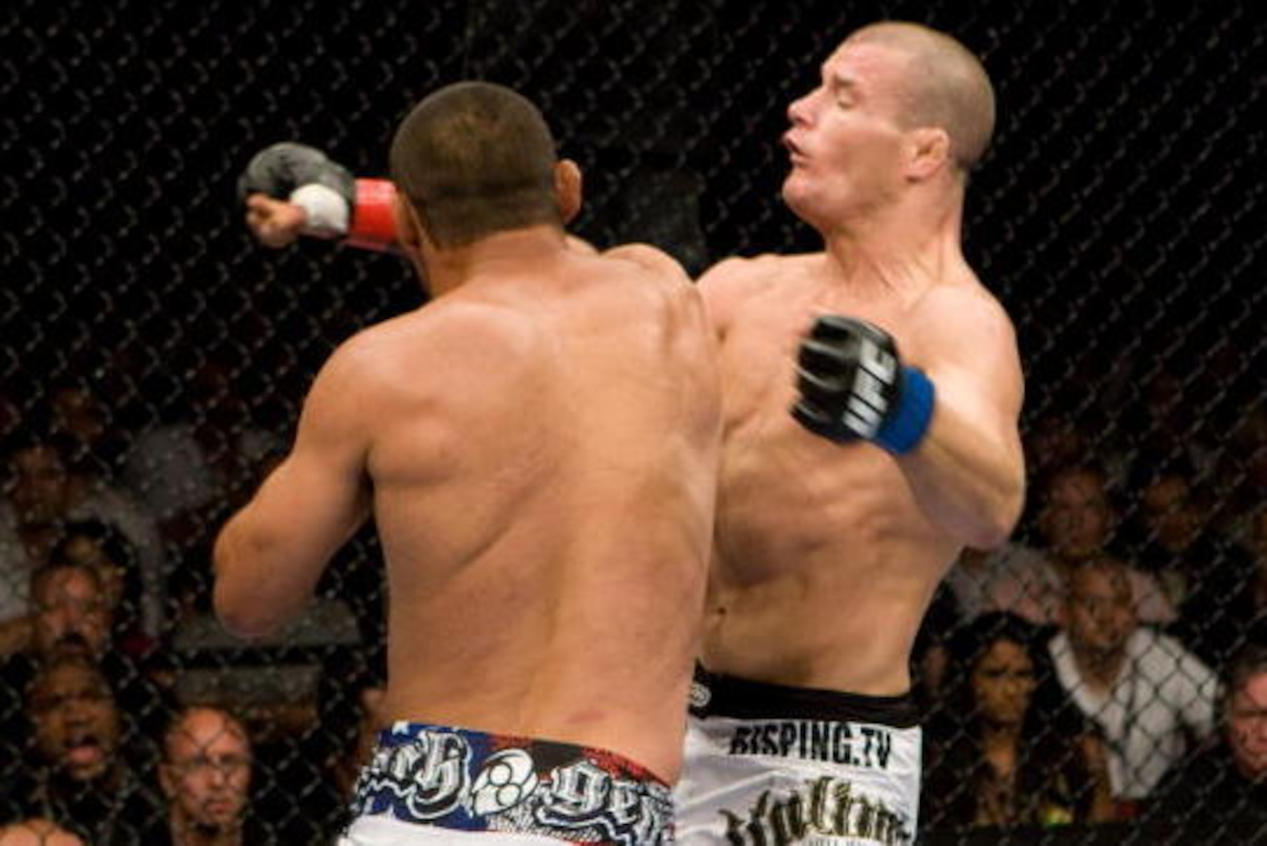 LAS VEGAS - JULY 11:  Dan Henderson (white shorts) def. Michael Bisping (black/white shorts) - KO - 3:20 round 2 during UFC 100 at Mandalay Bay Events Center on July 11, 2009 in Las Vegas, Nevada. (Photo by Josh Hedges/Zuffa LLC via Getty Images)
