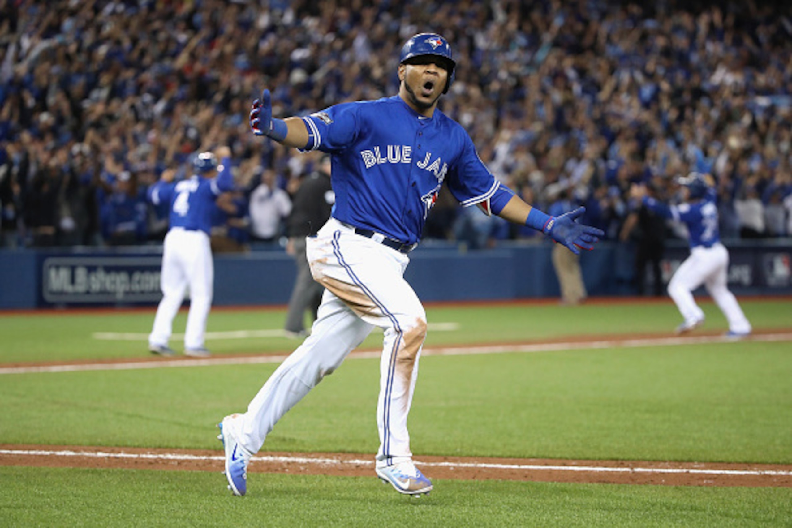 TORONTO, ON - OCTOBER 04:  Edwin Encarnacion #10 of the Toronto Blue Jays reacts after hitting a three-run walk-off home run in the eleventh inning to defeat the Baltimore Orioles 5-2 in the American League Wild Card game at Rogers Centre on October 4, 20