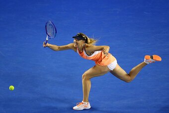 MELBOURNE, AUSTRALIA - JANUARY 24:  Maria Sharapova of Russia plays a forehand in her fourth round match against Belinda Bencic of Switerland during day seven of the 2016 Australian Open at Melbourne Park on January 24, 2016 in Melbourne, Australia.  (Pho