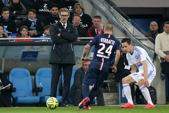 MARSEILLE, FRANCE - APRIL 5:  Coach of PSG Laurent Blanc looks on his player Marco Verratti of PSG in action during the French Ligue 1 match between Olympique de Marseille (OM) and Paris Saint-Germain (PSG) at New Stade Velodrome on April 5, 2015 in Marse
