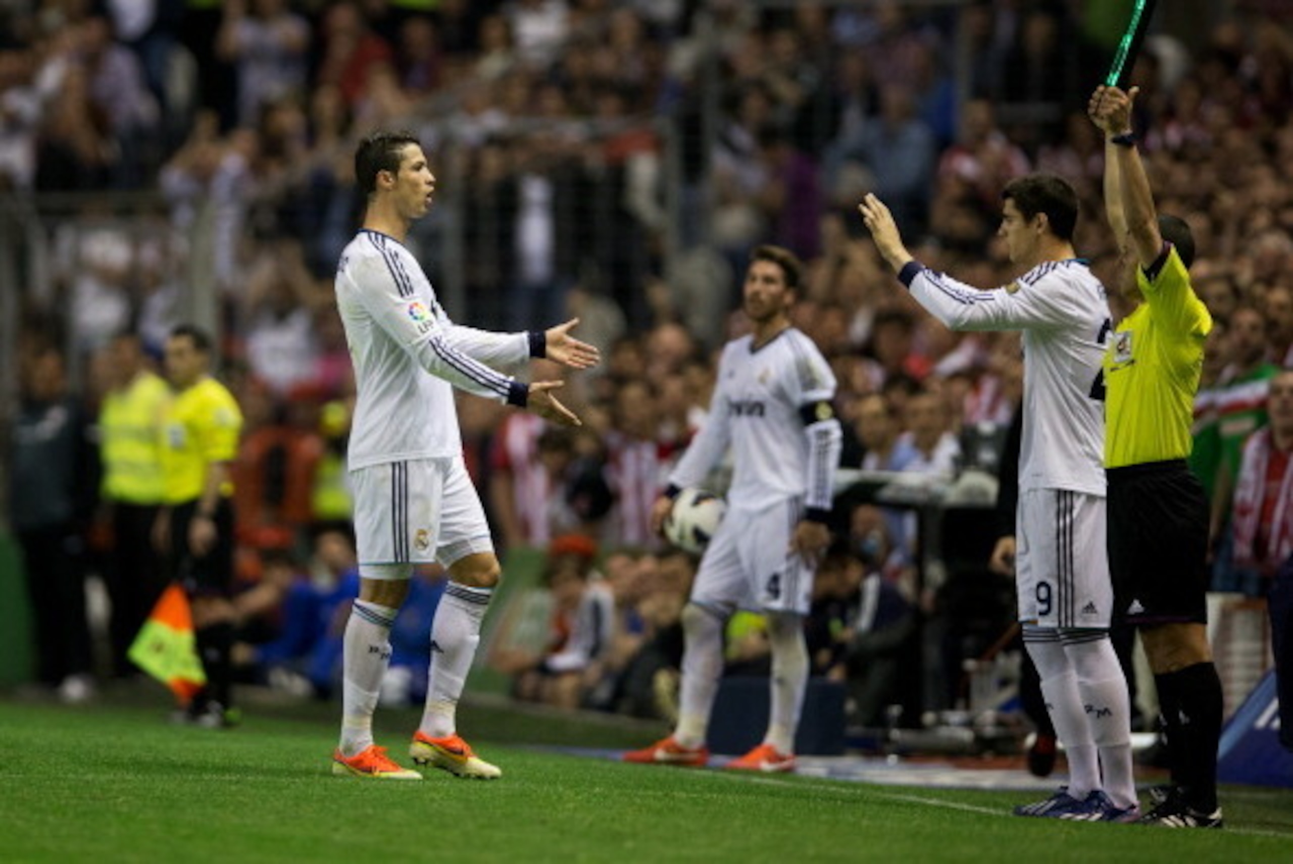 BILBAO, SPAIN - APRIL 14:  Cristiano Ronaldo (L) of Real Madrid welcomes his teammate Alvaro Morata onto the pitch as he is being substituted during the la Liga match between Athletic Club and Real Madrid CF at San Mames Stadium on April 14, 2013 in Bilba