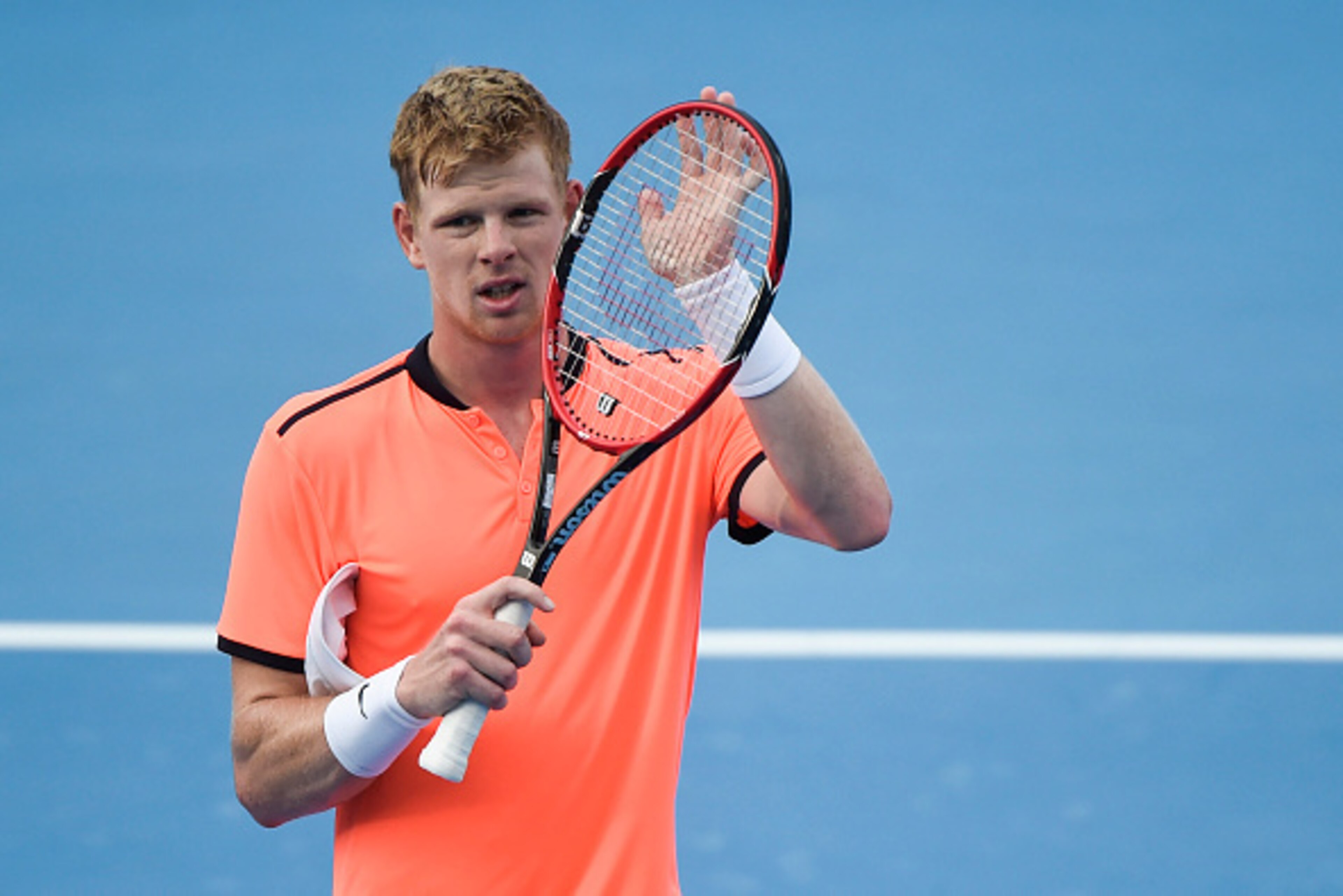 Kyle Edmund of Britain reacts after he defeated Roberto Bautista Agut of Spain during their men's singles first round match at the China Open tennis tournament in Beijing on October 5, 2016.  / AFP / FRED DUFOUR        (Photo credit should read FRED DUFOU