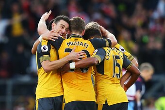BURNLEY, ENGLAND - OCTOBER 02: Laurent Koscielny of Arsenal (L) celebrates scoring his sides first goal with his team mates during the Premier League match between Burnley and Arsenal at Turf Moor on October 2, 2016 in Burnley, England.  (Photo by Alex Li