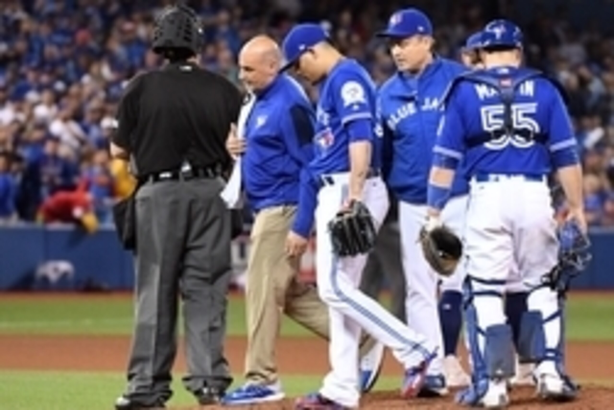 Oct 4, 2016; Toronto, Ontario, CAN; Toronto Blue Jays relief pitcher Roberto Osuna (54) leaves the game during the tenth inning with an apparent injury in the American League wild card playoff baseball game against the Baltimore Orioles at Rogers Centre. 