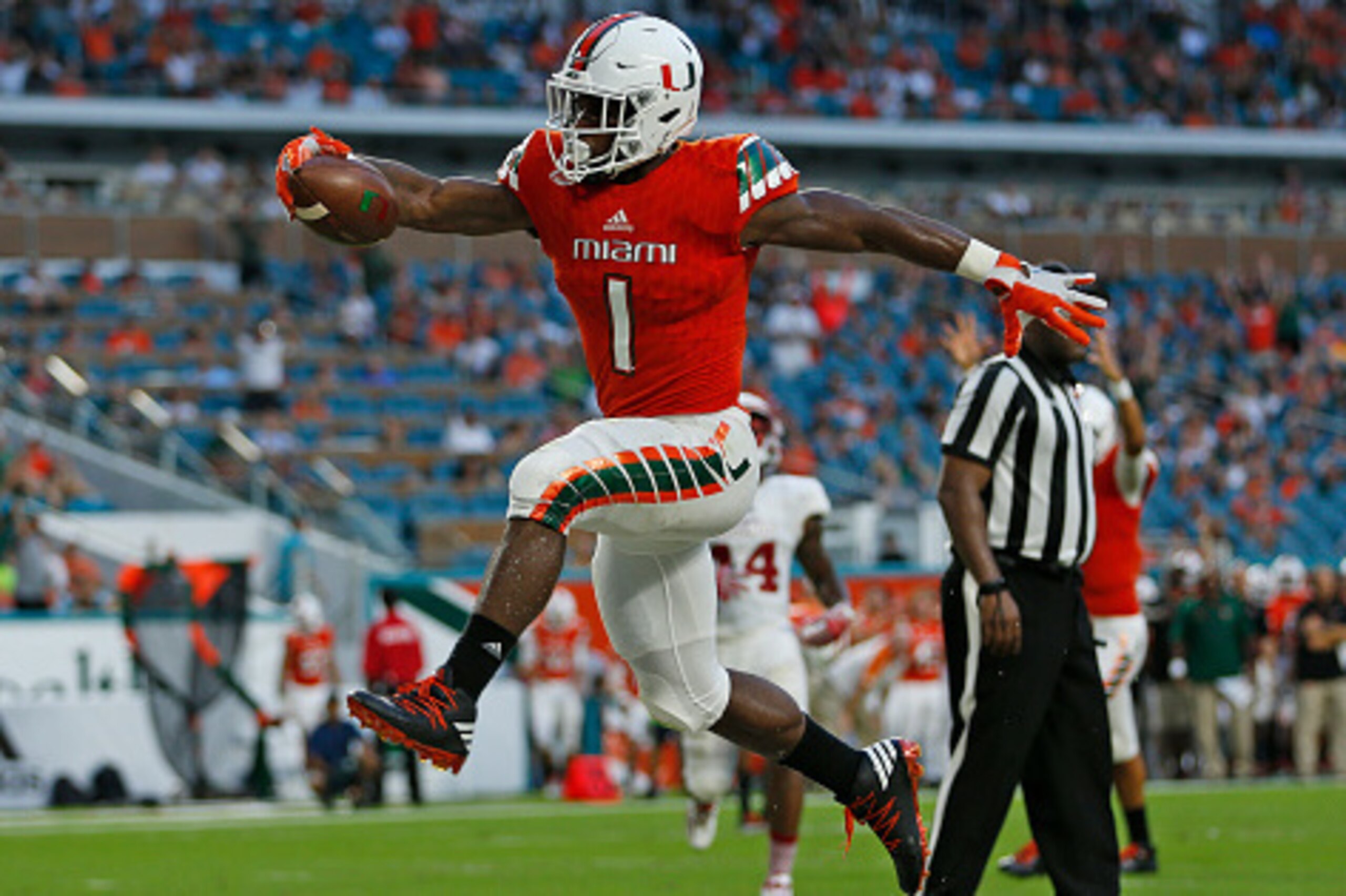 MIAMI GARDENS, FL - SEPTEMBER 10: Mark Walton #1 of the Miami Hurricanes celebrates after scoring a second quarter touchdown against the Florida Atlantic Owls on September 10, 2016 at Hard Rock Stadium in Miami Gardens, Florida.(Photo by Joel Auerbach/Get