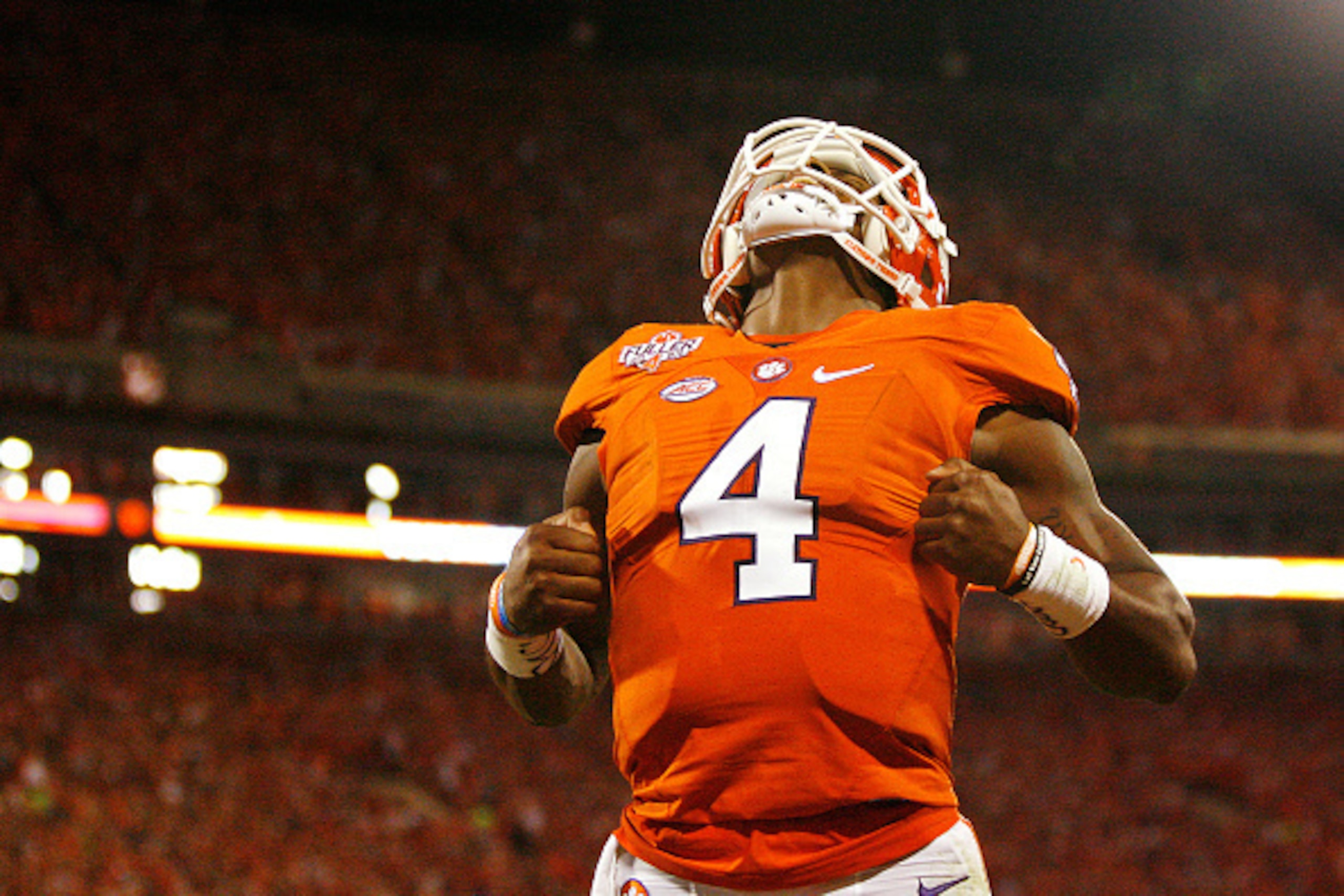 CLEMSON, SC - OCTOBER 01: Deshaun Watson #4 of the Clemson Tigers reacts after throwing a second quarter touchdown pass to Deon Cain #8 (not pictured against the Louisville Cardinals at Memorial Stadium on October 1, 2016 in Clemson, South Carolina. (Pho CLEMSON, SC - OCTOBER 01: Deshaun Watson #4 of the Clemson Tigers reacts after throwing a second quarter touchdown pass to Deon Cain #8 (not pictured against the Louisville Cardinals at Memorial Stadium on October 1, 2016 in Clemson, South Carolina. (Pho
