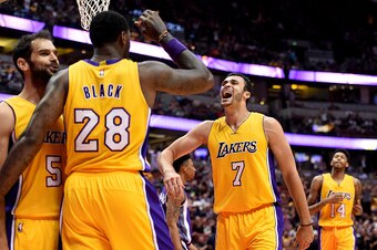 ANAHEIM, CA - OCTOBER 04:  Larry Nance Jr. #7 of the Los Angeles Lakers celebrates a play with Jose Calderon #5 and Tarik Black #28 during a preseason game against the Sacramento Kings at Honda Center on October 4, 2016 in Anaheim, California.  NOTE TO US