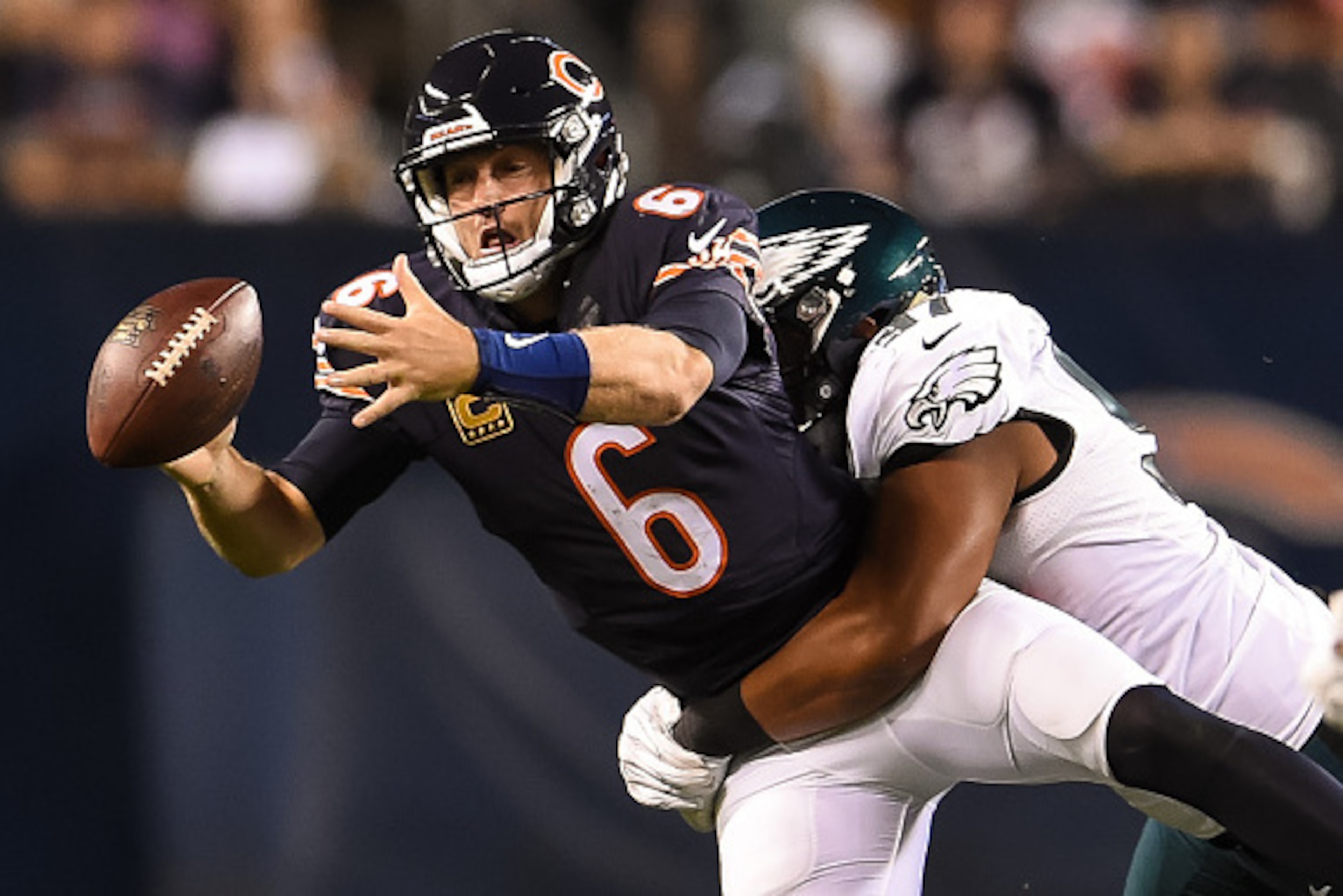 CHICAGO, IL - SEPTEMBER 19:  Quarterback  Jay Cutler #6 of the Chicago Bears fumbles the football against  Destiny Vaeao #97 of the Philadelphia Eagles in the second half at Soldier Field on September 19, 2016 in Chicago, Illinois.  (Photo by Stacy Revere