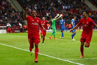 WARSAW, POLAND - MAY 27:  Carlos Bacca of Sevilla celebrates scoring his team's third goal with Vitolo of Sevilla during the UEFA Europa League Final match between FC Dnipro Dnipropetrovsk and FC Sevilla on May 27, 2015 in Warsaw, Poland.  (Photo by Micha